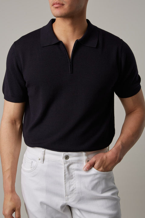 Fireball Zip Polo Navy worn by a model, front view of the quarter-zip collar