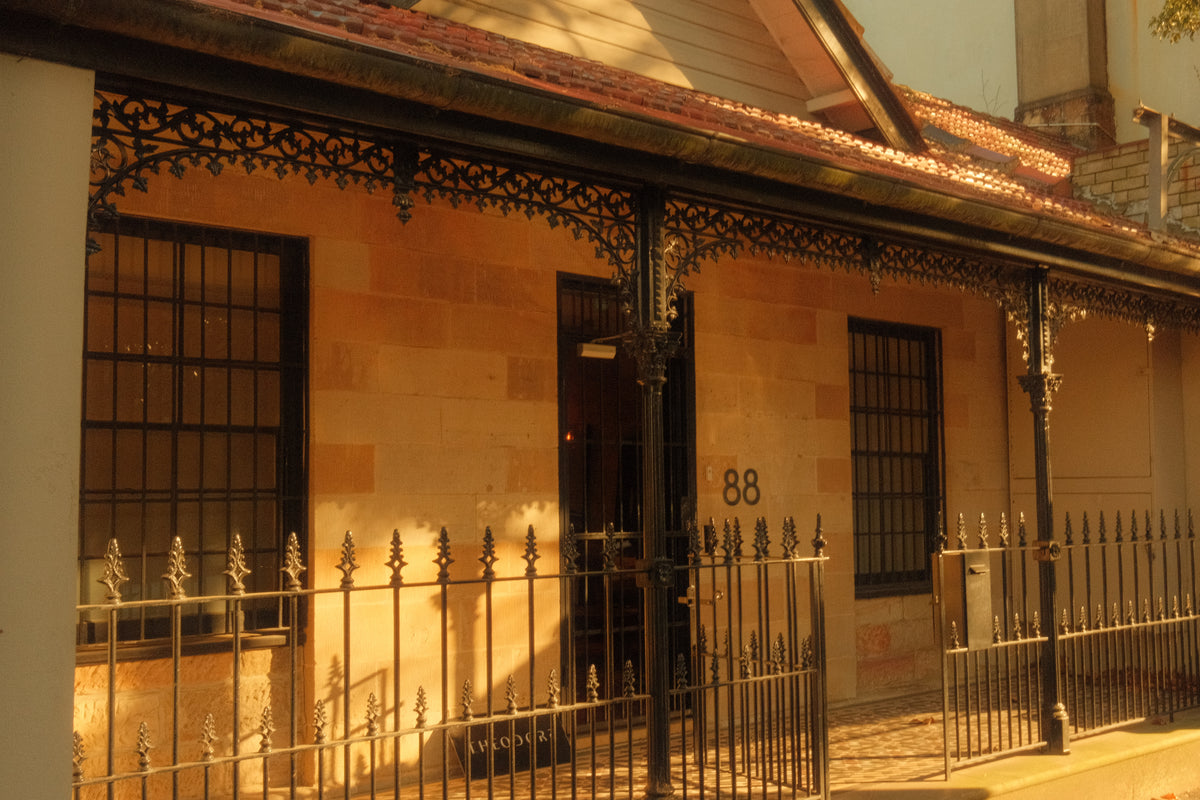 The sandstone terrace at 88 Pitt Street, Redfern, with its cast-iron verandah
