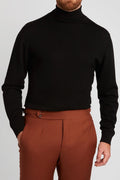 Irish Coffee Turtleneck Black worn close-up with rust-toned trousers