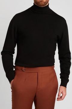 Irish Coffee Turtleneck Black worn close-up with rust-toned trousers
