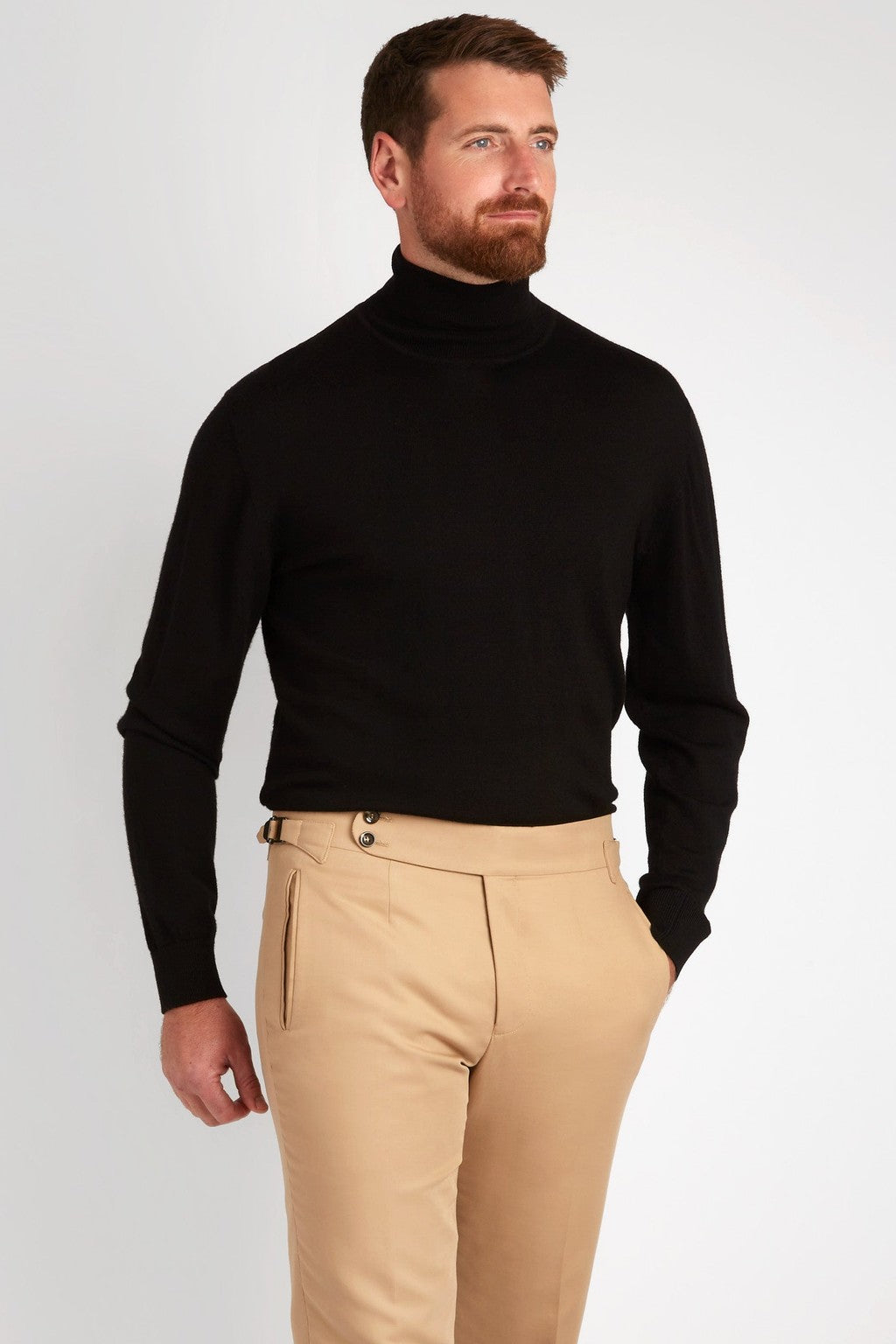 Irish Coffee Turtleneck Black worn with tan trousers, three-quarter turn