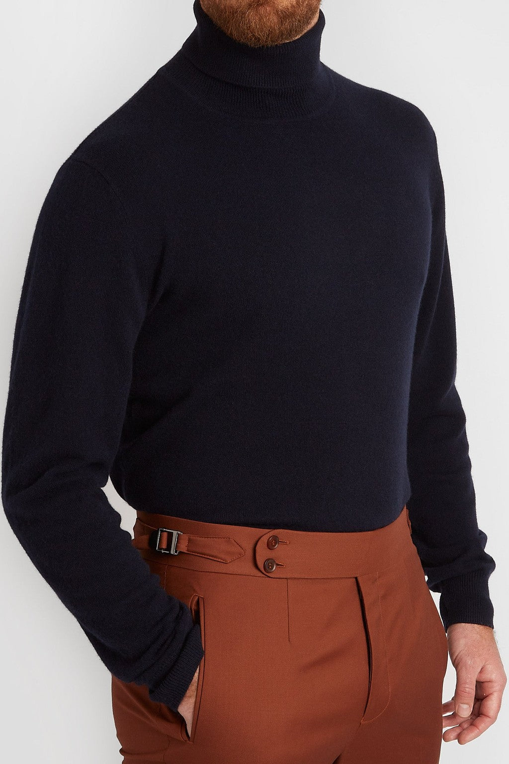 Irish Coffee Turtleneck Navy, close torso crop worn with rust trousers
