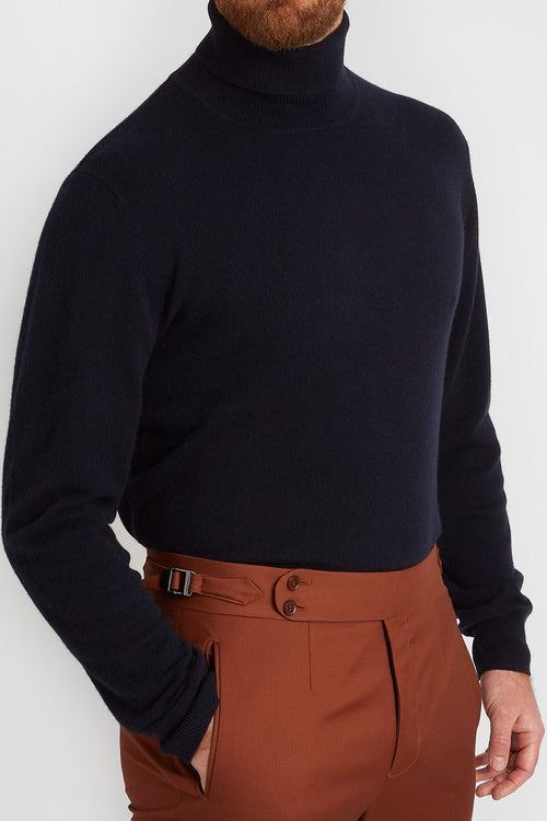 Irish Coffee Turtleneck Navy, close torso crop worn with rust trousers