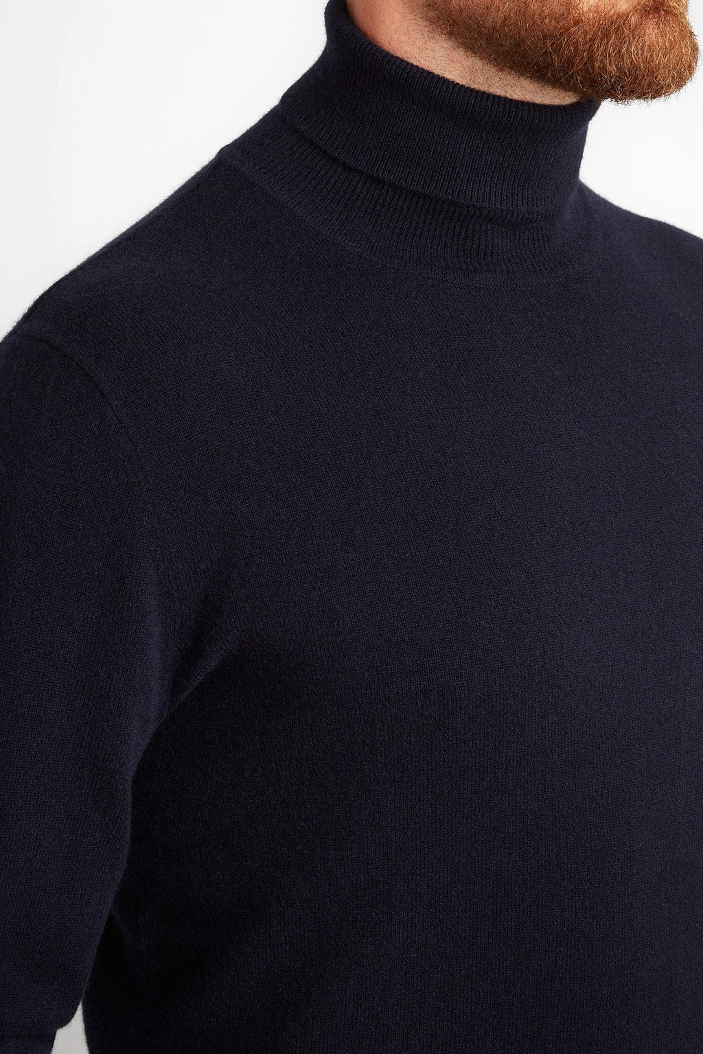 Irish Coffee Turtleneck Navy, close-up side view of the ribbed roll neck