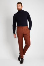 Irish Coffee Turtleneck Navy worn alone with rust trousers, full front view