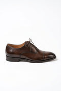The Maison Soft Leather Brown Derby on white, side profile showing the burnished cap toe and sole
