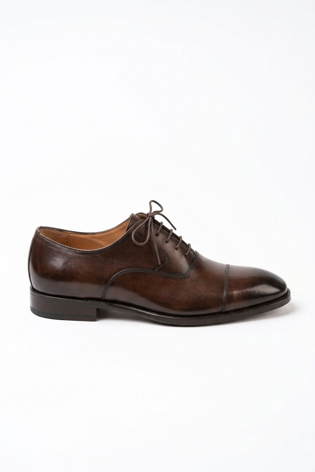 The Maison Soft Leather Brown Derby on white, side profile showing the burnished cap toe and sole