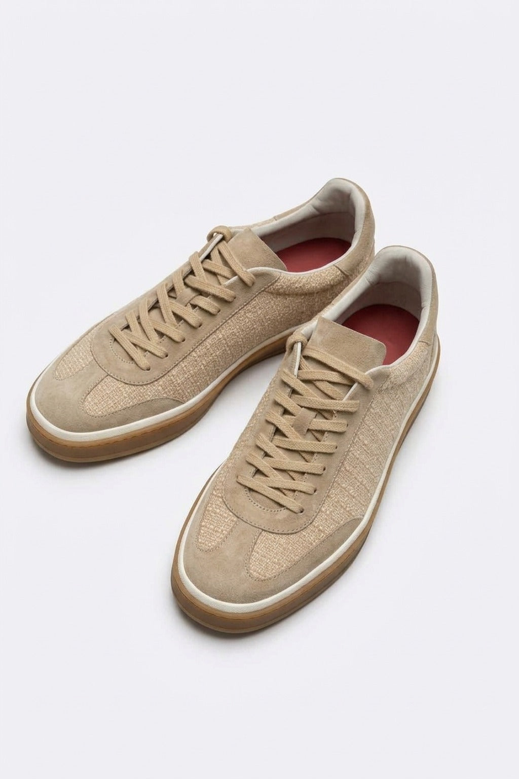 The Riva Beige Suede Sneaker, pair from above in the studio
