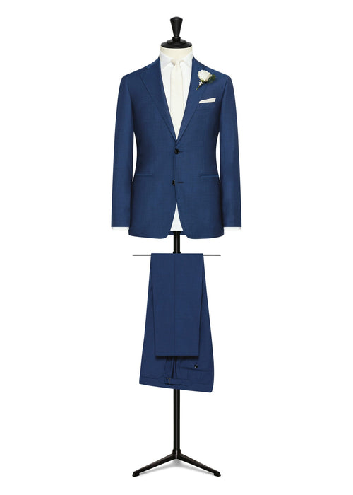 Barrington Royal Blue Wool Suit on a mannequin, styled with a cream tie and boutonniere